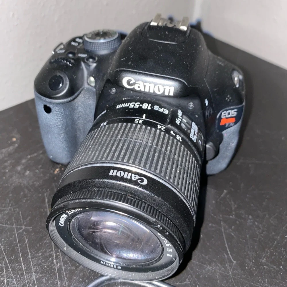 Canon Camera , Battery Charger with Cable, camera bag and batteries , lense